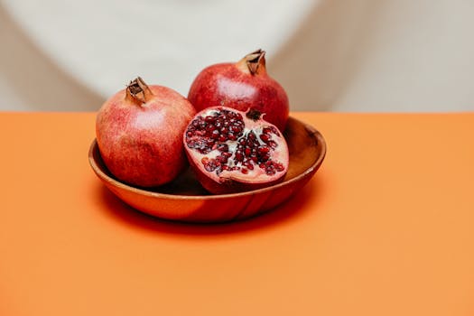 a colorful smoothie bowl topped with fresh fruits and seeds